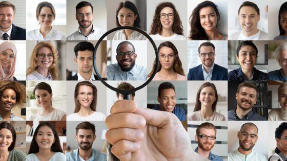 Magnifying glass over photos of candidates