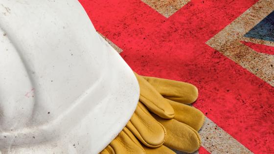 Construction Workers Hard Hat and Gloves on flag of Great Britain